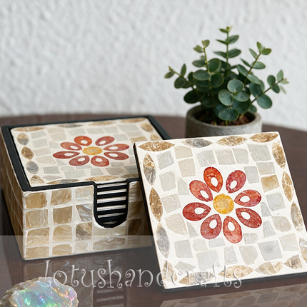 Demonstrating the water-resistant and easy-to-clean surface as a hand wipes a coaster clean with a soft white cloth.