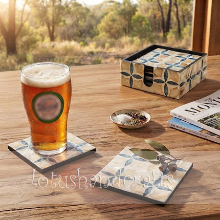 elegant mother of pearl coaster set displayed on wooden table with soft glow.
