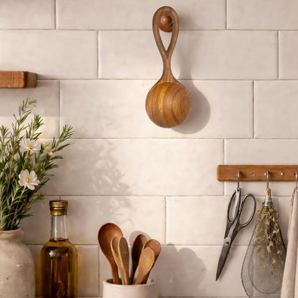 Hand carved doussie wood spoon for kitchen decor adds a natural and elegant touch to your living space.