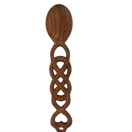 Beautiful handmade wooden heart spoon featuring an oval bowl and intricate carved handle with heart-shaped detail, elegant and artistic.