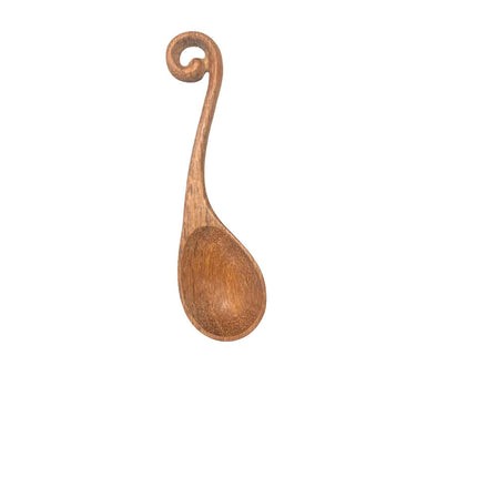 Handcrafted wooden spoon with hole designed for everyday cooking use, offering durability, comfort, and a user friendly experience.