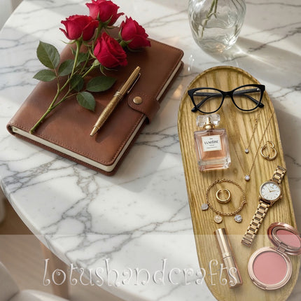 Handcarved Haven oval ashwood serving tray in a warm minimalist flatlay setting for modern living.