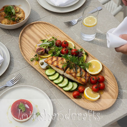 Handcarved Haven oval ashwood serving tray with a minimalist design that is beautiful and easy to clean.