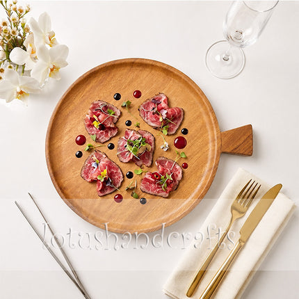 This small round ashwood serving tray with a handle is perfect for your food plating.