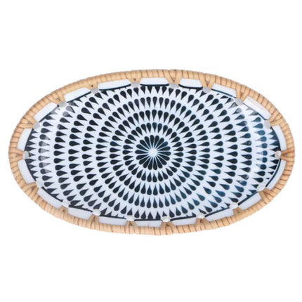 Black spiral pattern with layered teardrop motifs radiating across the white ceramic surface.