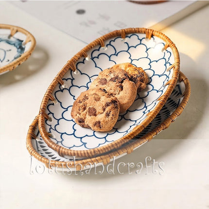 Intricate blue-and-white floral artwork paired with a warm natural rattan woven edge.