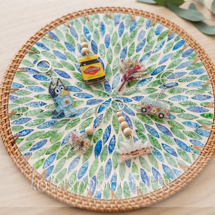 Round mother of pearl rattan with blue green botanical leaf burst  charger plate.