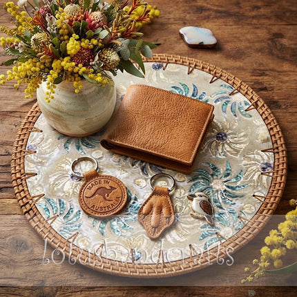 Natural woven rattan border framing an artistic floral pattern with soft white, turquoise, and blue tones.