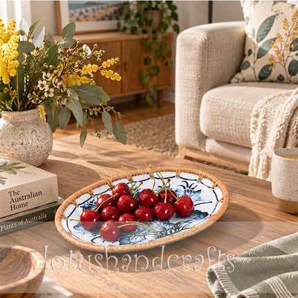 Elegant blue and teal lotus blossoms create a graceful botanical pattern across the oval tray.