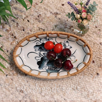 Natural woven rattan frames the blue floral artwork with warm texture and handcrafted charm.