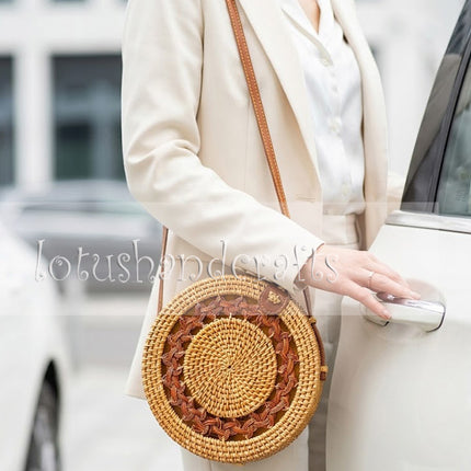 Handcrafted intricate braided mandala round rattan crossbody bag with a unique artisanal design.