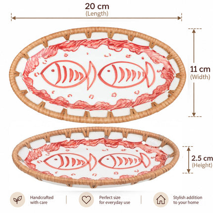Two graceful red fish with flowing tails bring an artistic seaside character to the oval tray.