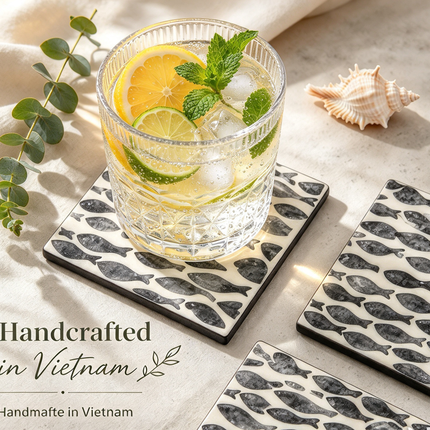 Nautical-inspired coaster set in ivory & navy, handcrafted from natural mother-of-pearl.