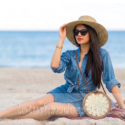 Unique handmade round rattan crossbody bag featuring a pearl flower mother of pearl inlay.