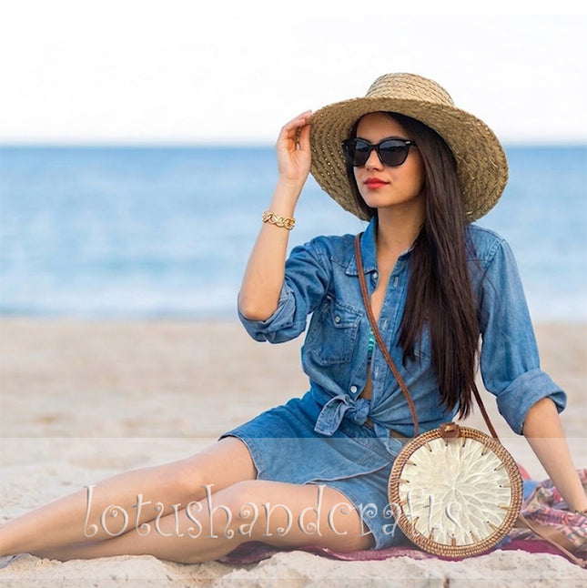 Unique handmade round rattan crossbody bag featuring a pearl flower mother of pearl inlay.