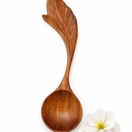 Handmade floating leaf wooden spoon crafted from redwood offers natural beauty and lasting durability.