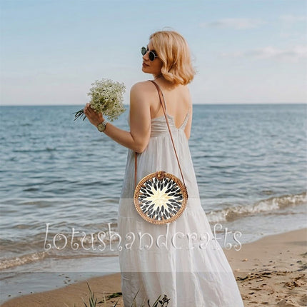 Elegant round boho woven rattan straw crossbody purse with mother of pearl.