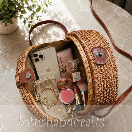 Luxury boho round rattan crossbody bag with green leaf mother of pearl inlay.