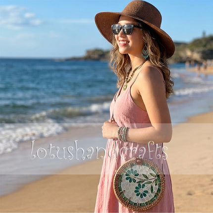 Jade Petal Mosaic Round Rattan Crossbody Bag with Mother of Pearl complements any outfit beautifully.