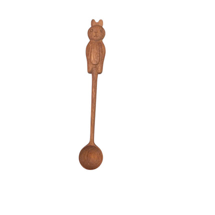 This handcrafted wooden spoon features a cute bunny handle, adding charm to any kitchen setting.