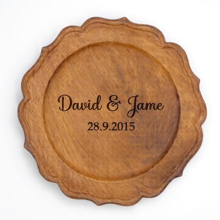 Handcrafted scalloped wood charger plate with custom engraving available upon request.