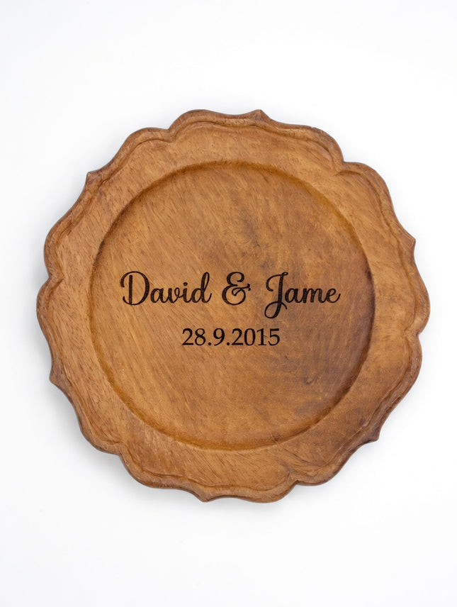 Handcrafted scalloped wood charger plate with custom engraving available upon request.