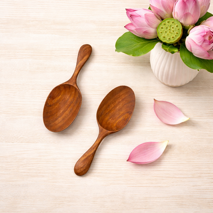 Oval mini shape wooden spoon made from natural wood with smooth finish and simple design.