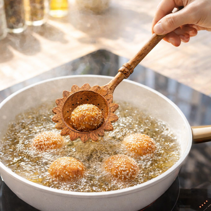 Sunflower wooden slotted spoon makes cooking easier and more enjoyable every day in your kitchen.