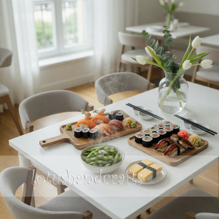 Long ash wood serving board with handle for plating snacks desserts and appetizers.