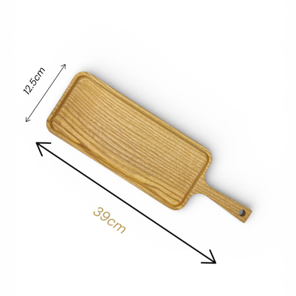 Long ash wood serving board with handle in a practical and elegant size.