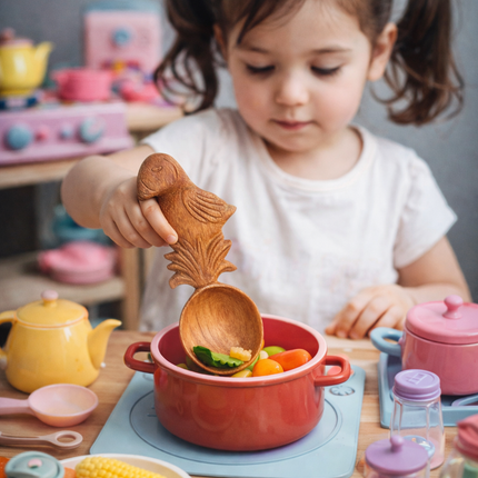 A handcrafted wooden bird spoon that is safe for users and designed for everyday comfort and beauty.