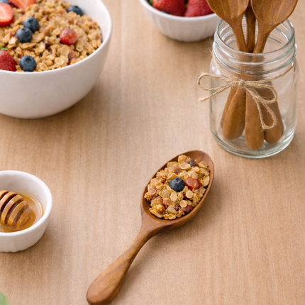 Oval mini wooden spoon with a smooth shape, safe and comfortable for everyday use.