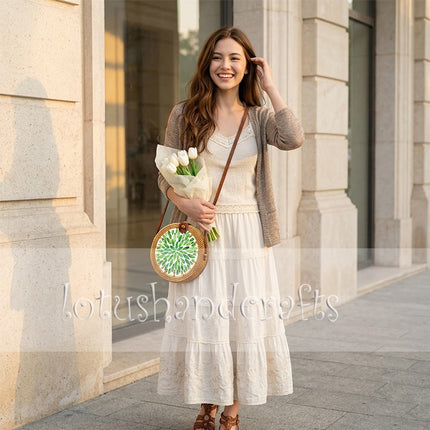 Boho round rattan crossbody bag with green leaf mother of pearl inlay that turns heads.