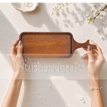 Rectangular redwood serving tray with handles offers versatile convenience for serving and home decor.