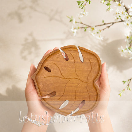 Cute redwood Monstera shaped serving tray with durable craftsmanship for elegant everyday serving and decor.