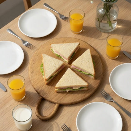 Round wood cutting board with loop handle offers many practical and versatile uses.