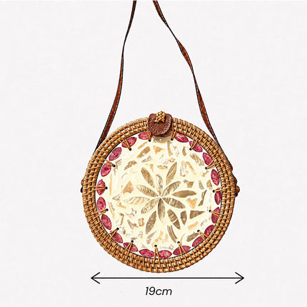 Lovely round rattan crossbody bag with inlaid mother of pearl size.