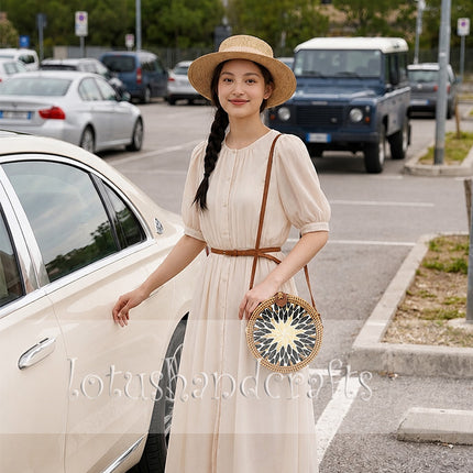 Attractive round woven rattan crossbody purse with mother of pearl wicker straw details.