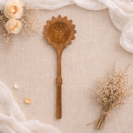 Handcrafted natural wooden sunflower slotted spoon perfect for cooking serving and everyday kitchen use.