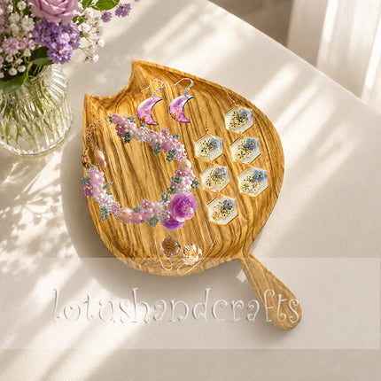 Cute tulip bud ashwood serving tray with handle in elegant flatlay composition.