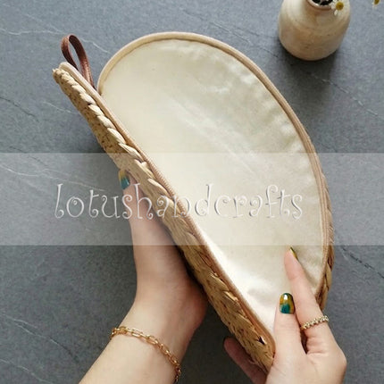 This cute water hyacinth half moon clutch is incredibly durable and perfect for everyday use.