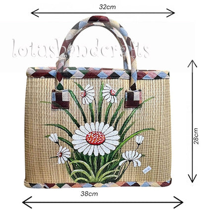 Handmade woven seagrass tote bag with a hand-painted white daisy garden, available in multiple sizes.
