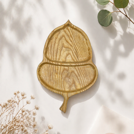Handcrafted ashwood acorn serving tray offers durable design and elegant natural style for everyday use.