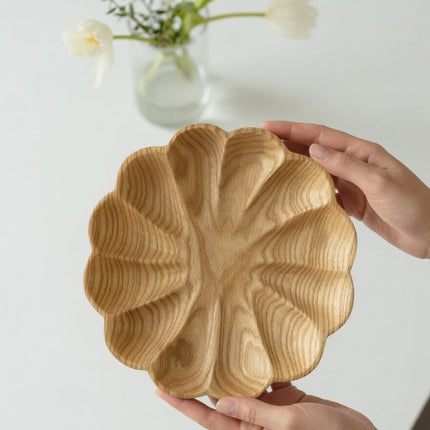 Wooden flower shaped serving plate handcrafted with a cute and elegant natural design.