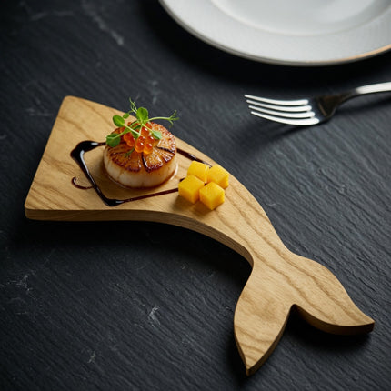 Handcrafted wooden whale tail shape tray for elegant plating and beautifully styled food presentation.