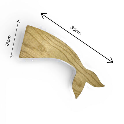 Handcrafted wooden whale tail shape tray available in multiple sizes for elegant serving and decor.