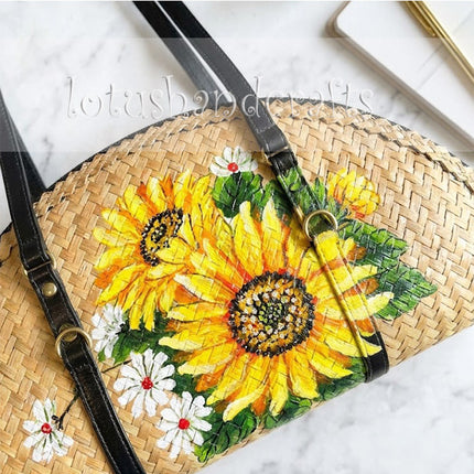 This elegant woven grass half moon with sunflowers is a beautifully delicate fashion accessory.