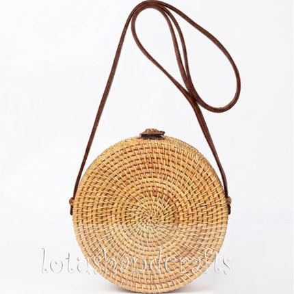 Back view of a green daisy round rattan crossbody bag with mother of pearl inlay.