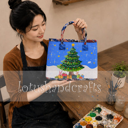 Handmade woven seagrass tote bag with painted Christmas tree design.