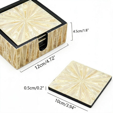 Champagne gold and creamy white shell mosaics with contrasting black edges for timeless table elegance.
